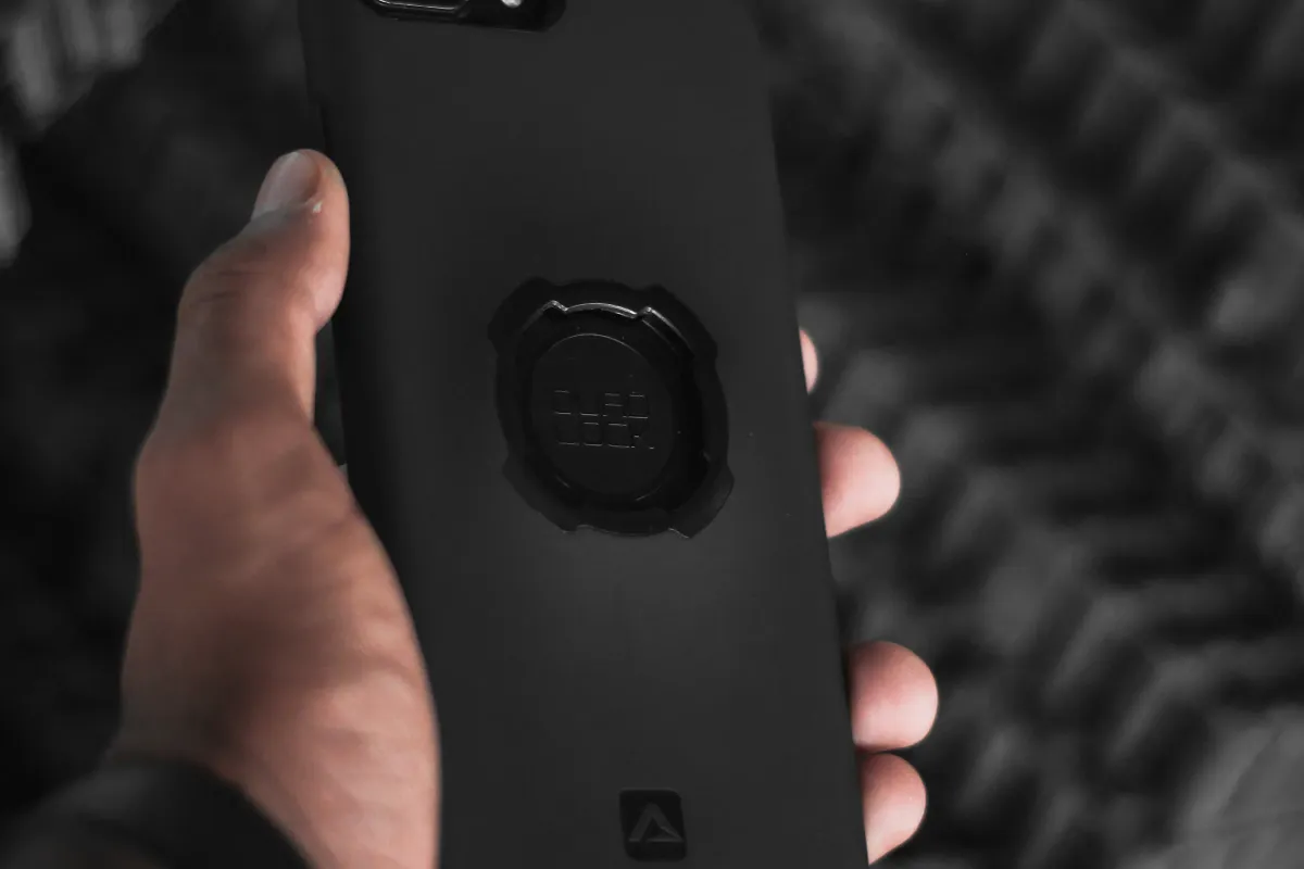 High-resolution close-up of an adult holding a smartphone
