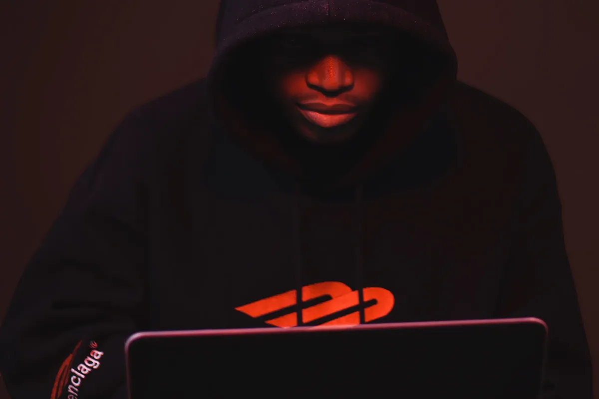 High-resolution photo of an adult using a laptop accompanying the login guide