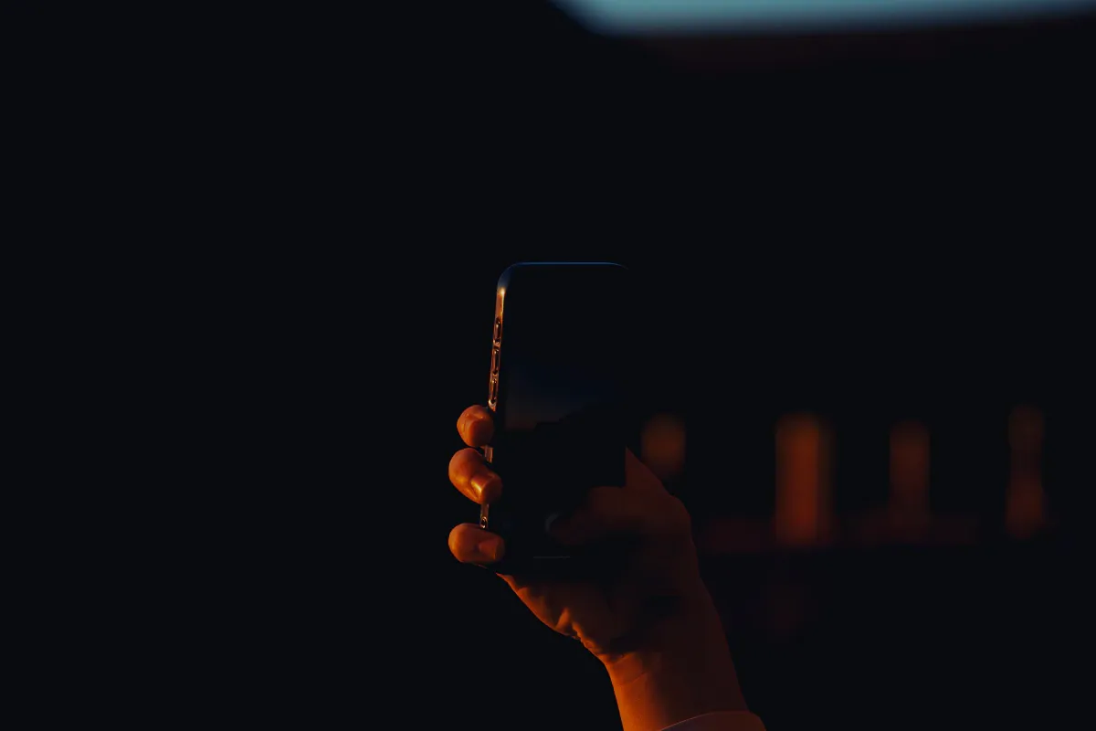 High-resolution smartphone photographed against a dark background