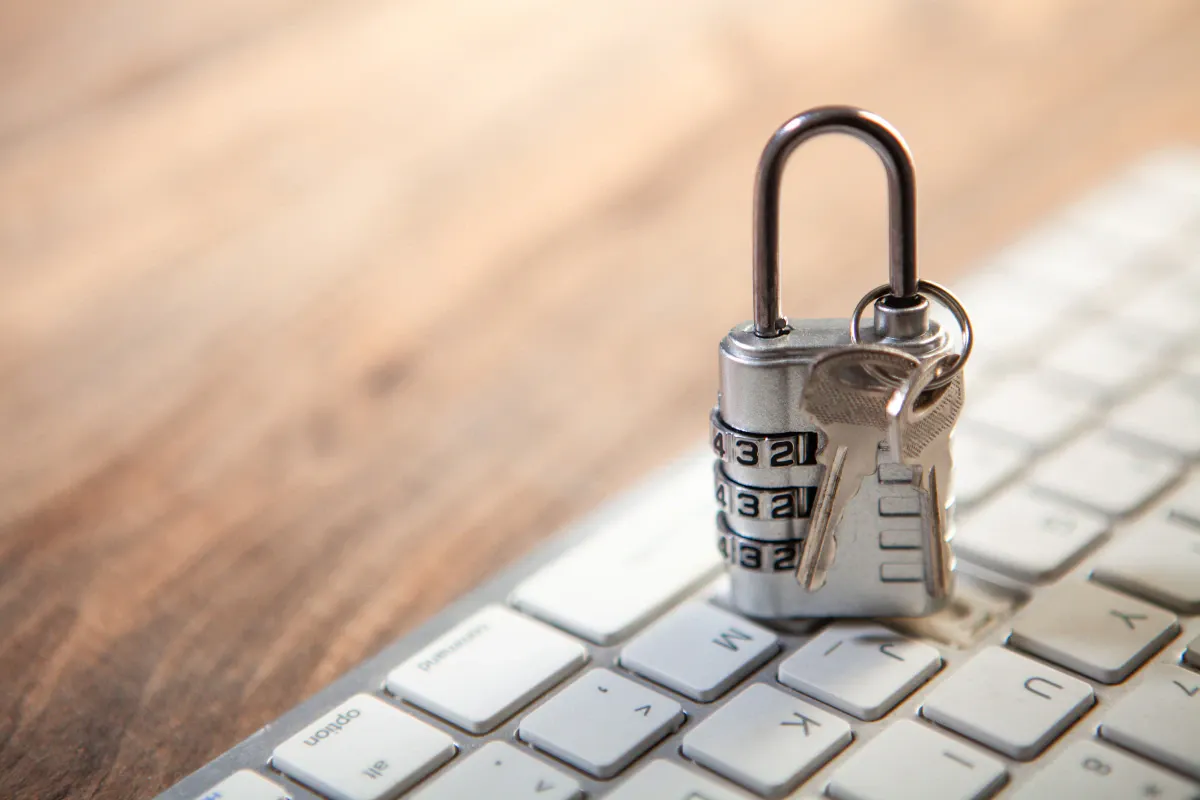 High-resolution padlock and keys on a keyboard accompanying the account security section